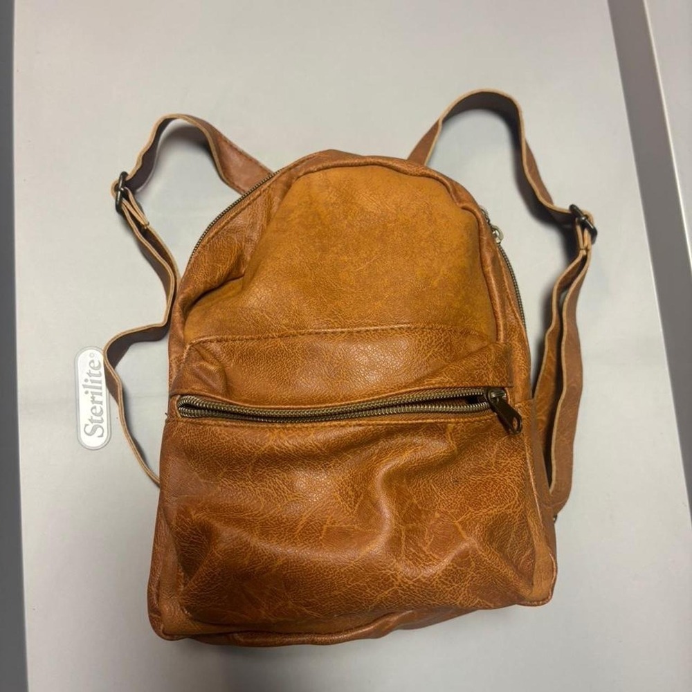 Brown leather backpack purse with gold details